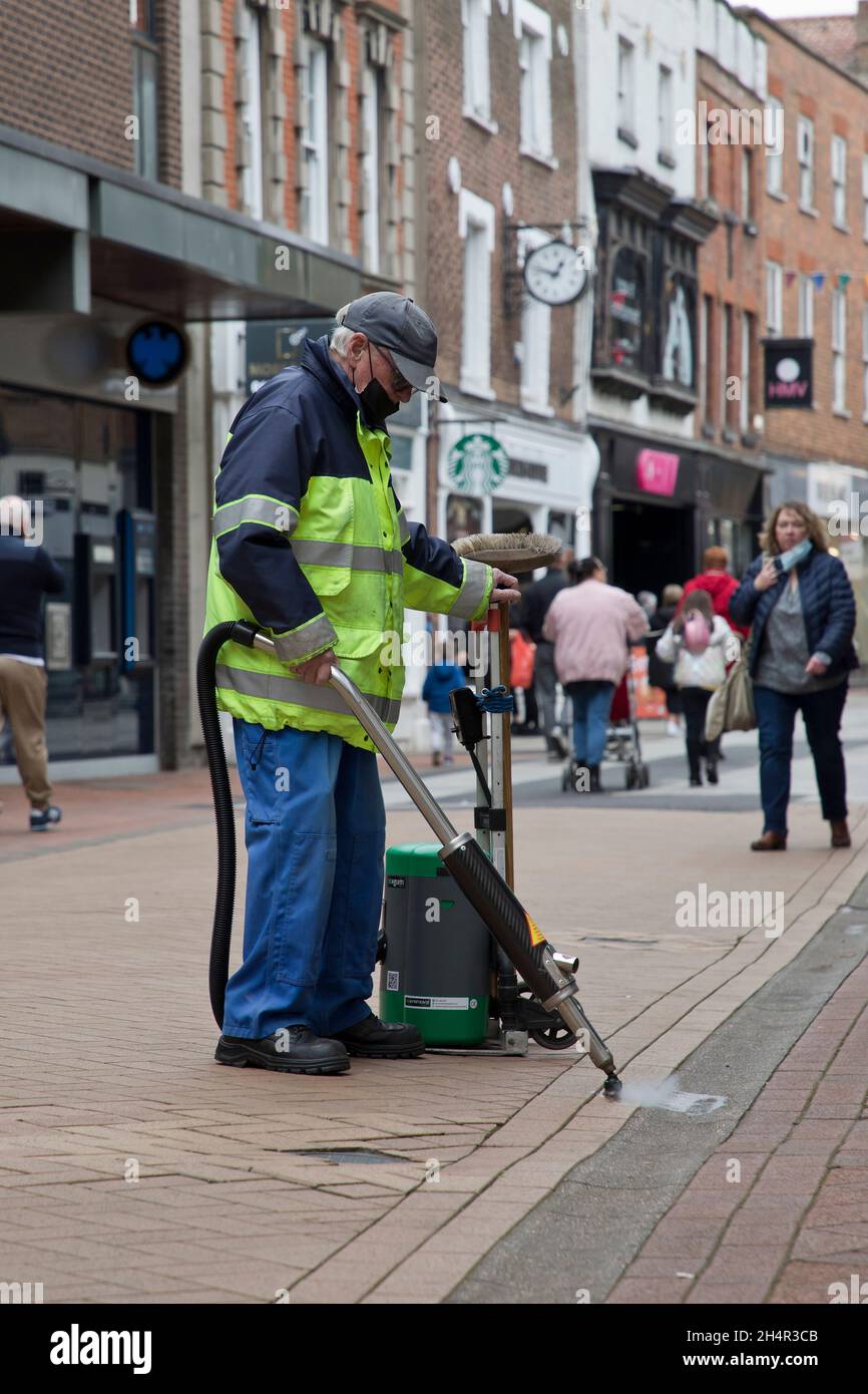 Council worker using chewing gum removal machine on King's Lynn High