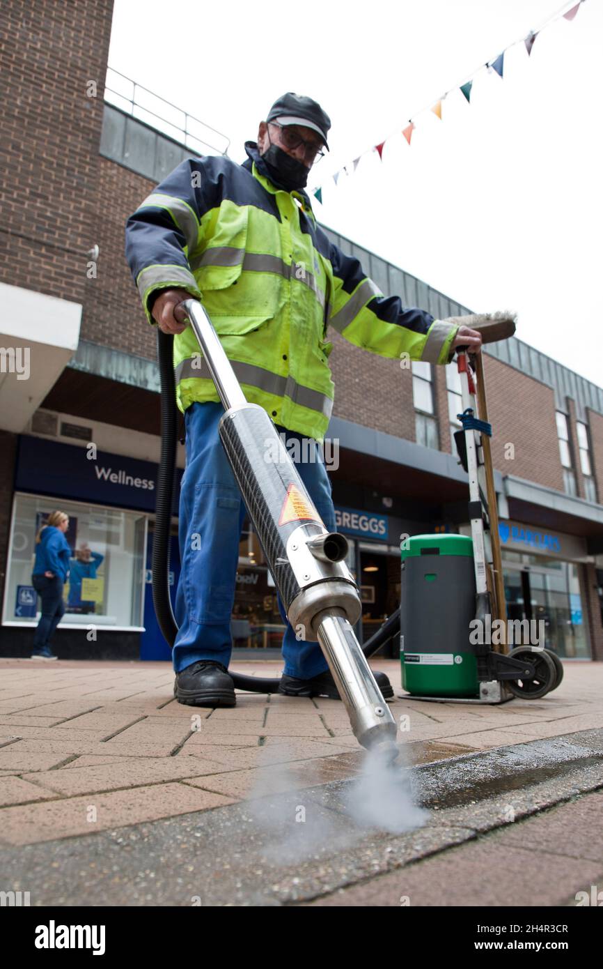 Council worker using chewing gum removal machine on King's Lynn High