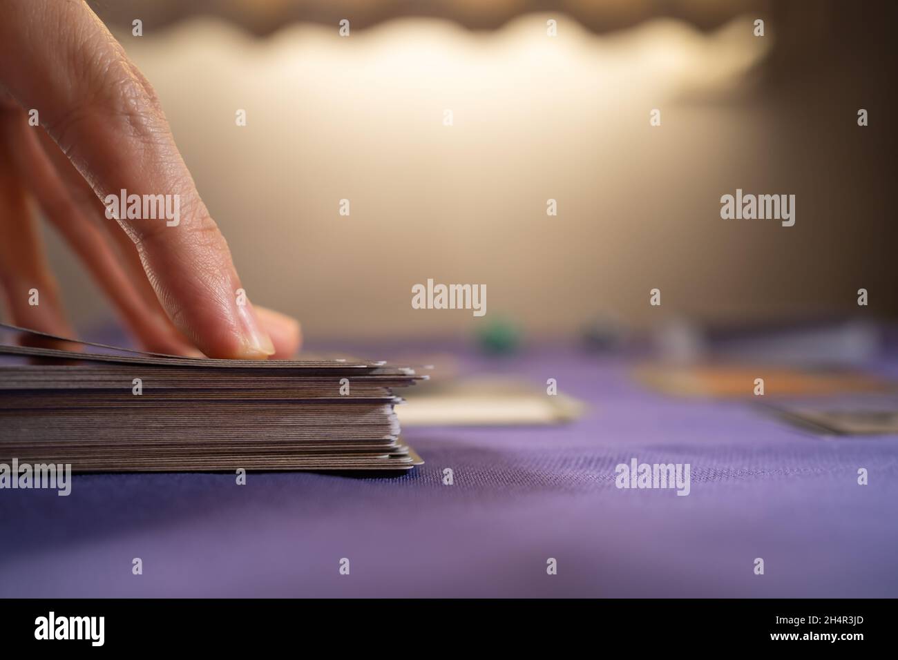 Playing trading card game on a table Stock Photo