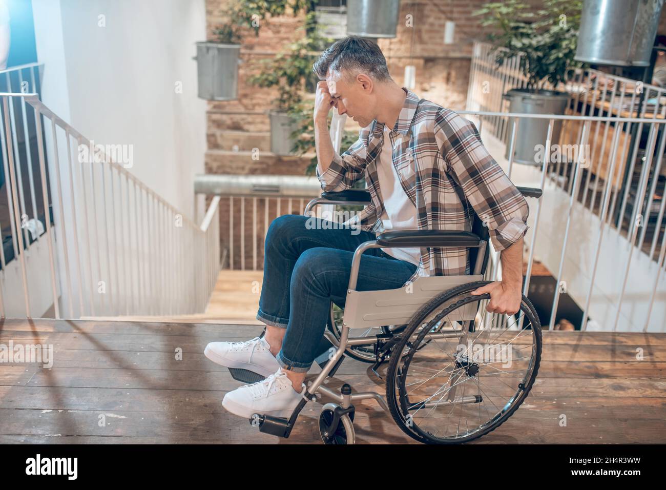 Man on wheelchair hi-res stock photography and images - Alamy
