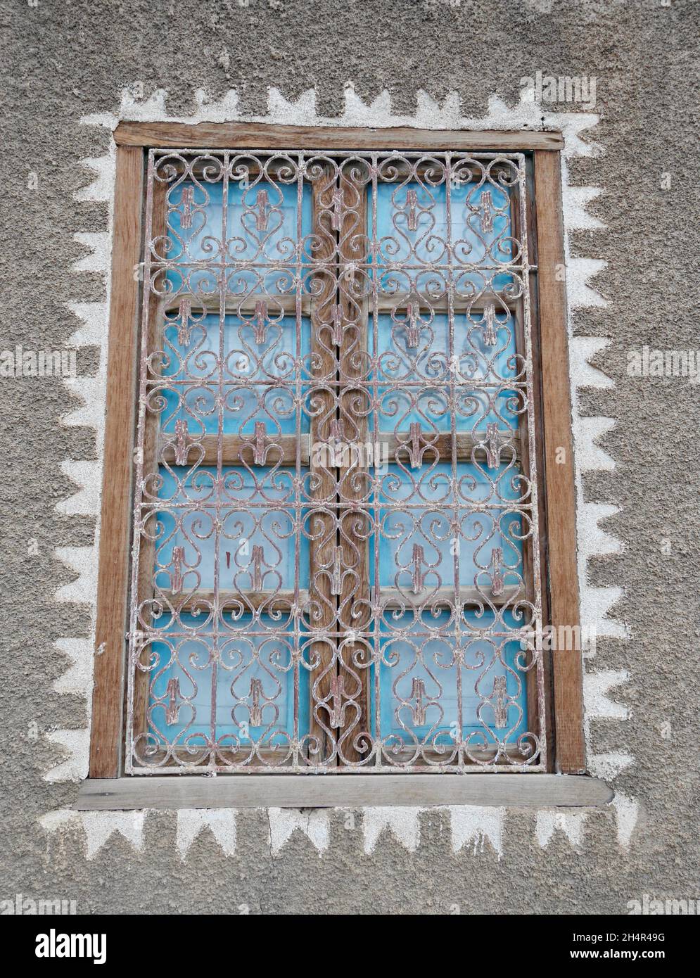 Close up of traditional window at Berber home. Typical Moroccan architecture detail of a window with ornate screen. Stock Photo