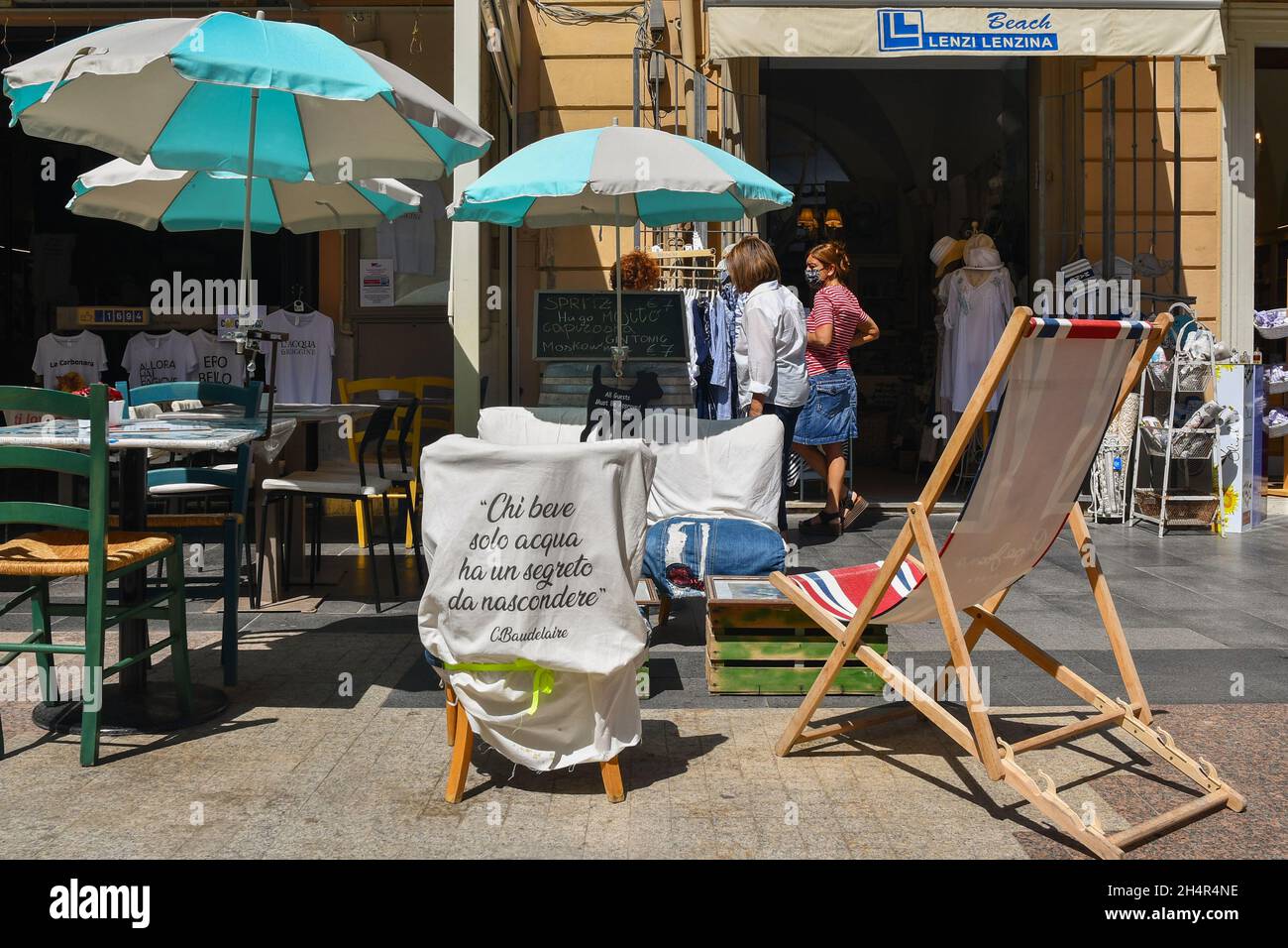 A sidewalk cafe in the historic centre of the fishing village of San Vincenzo in summer, Livorno, Tuscany, Italy Stock Photo