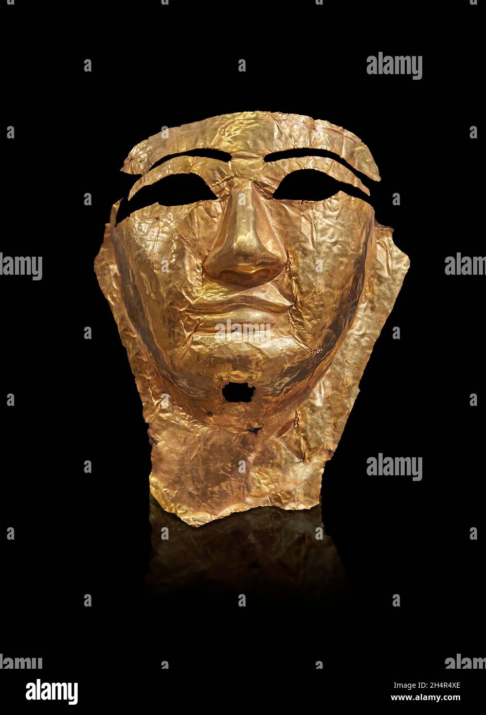Ancient Egyptian gold death mask, 1550-1068 BC ,New Kingdom ,  Louvre Museum inv N2731 or AF129. Height: 26.5 cm; Width: 20.5 cm; Thickness: 0.01 cm. Stock Photo
