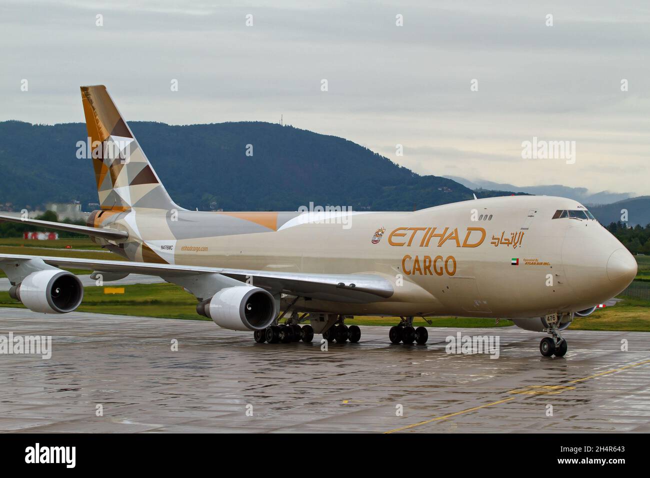 GRAZ, AUSTRIA - May 21, 2015: Etihad Cargo Boeing 747 cargo airplane on the apron in Graz Stock Photo