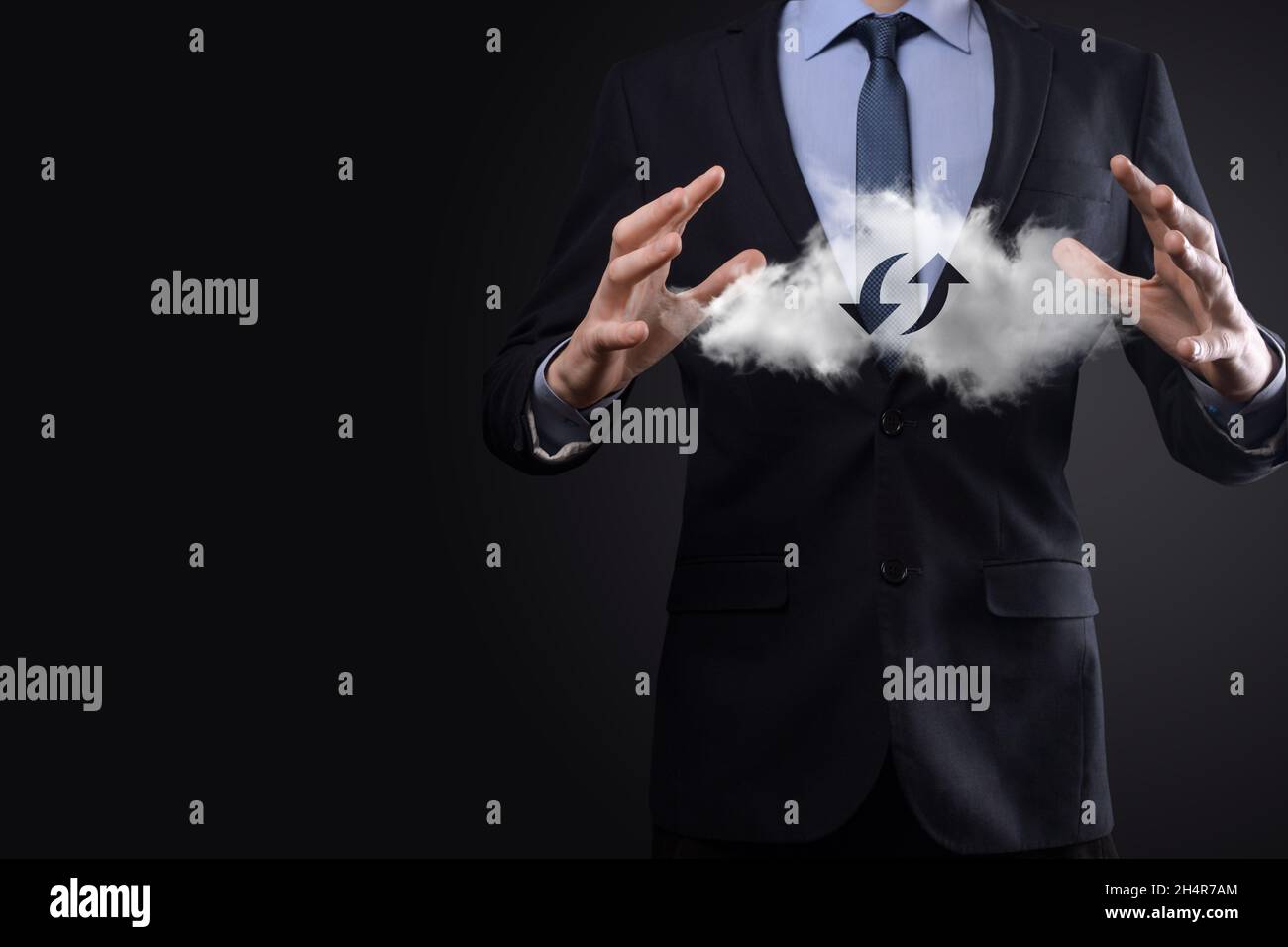 Cloud technology. Polygonal wireframe cloud storage sign with two arrows up and down on dark . Cloud computing, big data center, future infrastructure Stock Photo