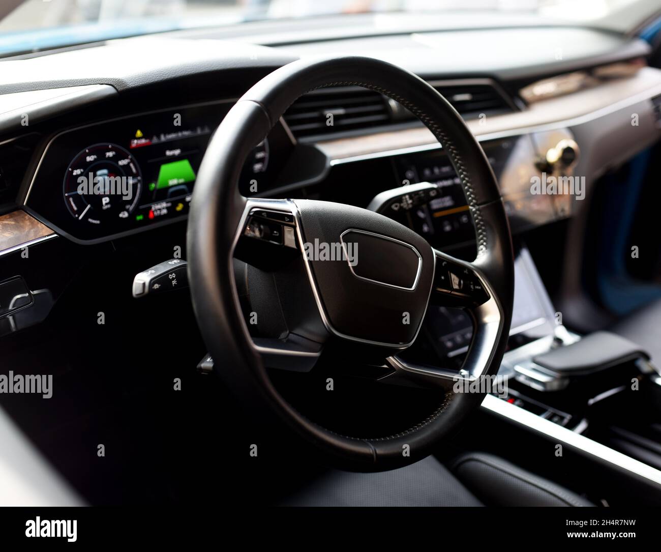 Steering wheel of an electric modern car. Car interior. Driver's seat
