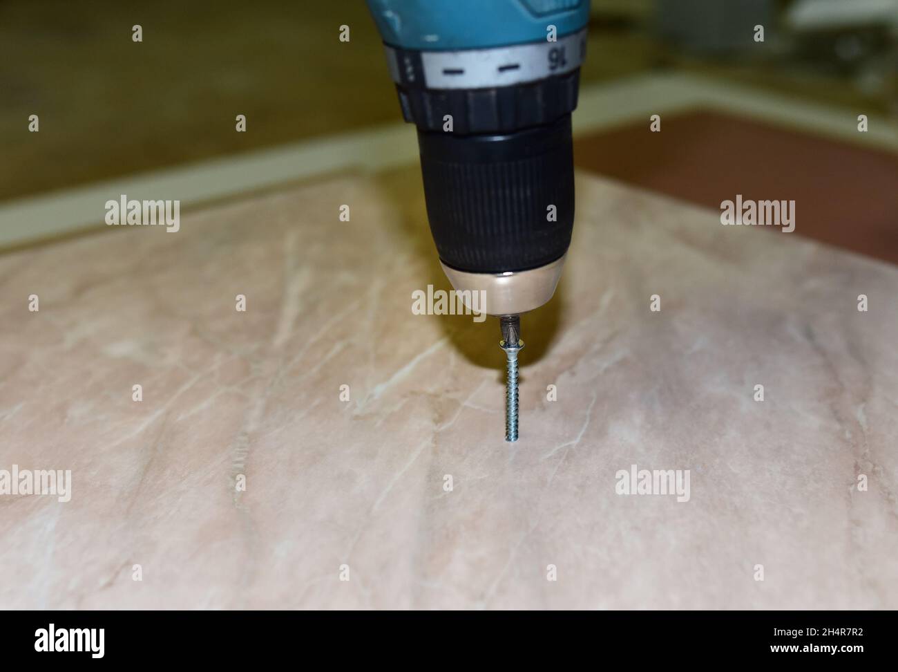 Drilling Screws while driving into wooden material. Construction
