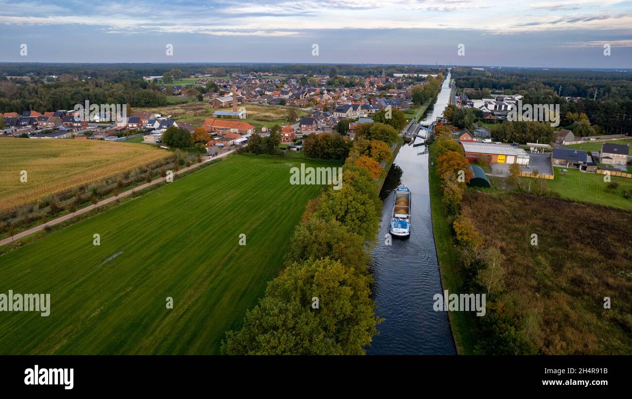 Aerial 4K Bird view shot with a drone of waterway with a barge or freight  cargo