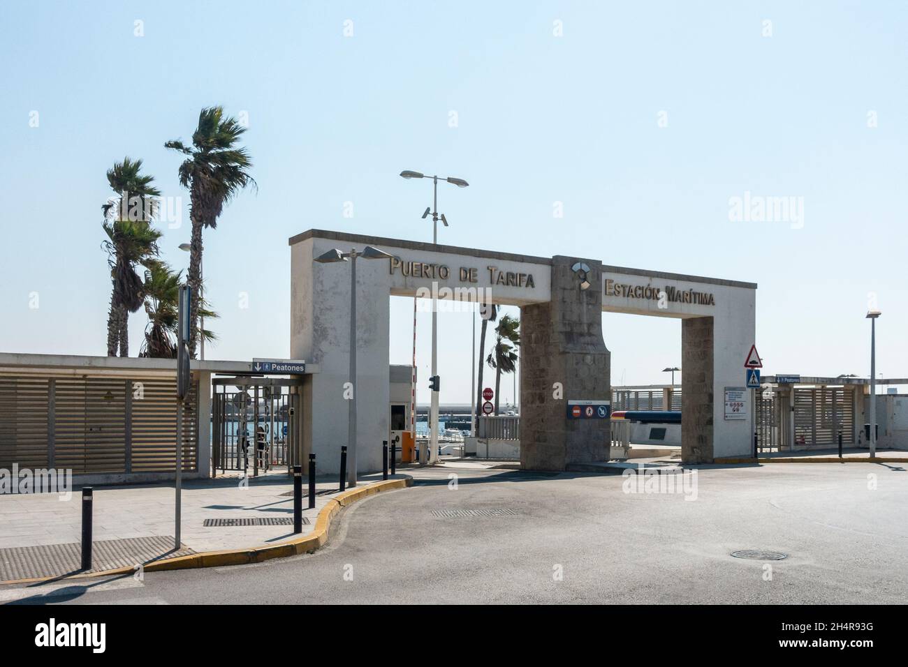 Entrance arches to the Port of Tarifa, which is a harbour and a terminal for the ferry to Morocco. Andalusia, southern Spain. Stock Photo