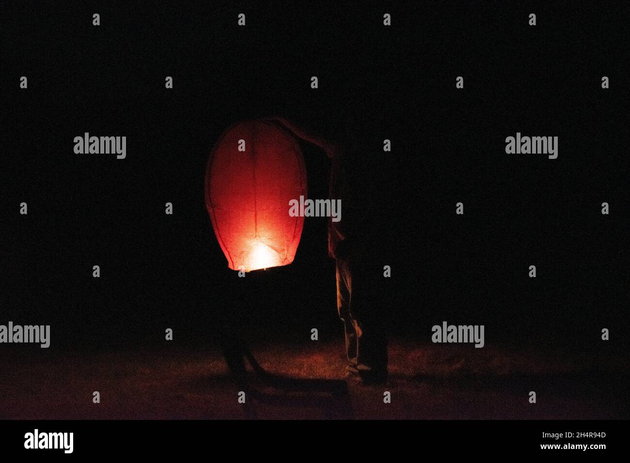Holding a sky lantern hi-res stock photography and images - Alamy