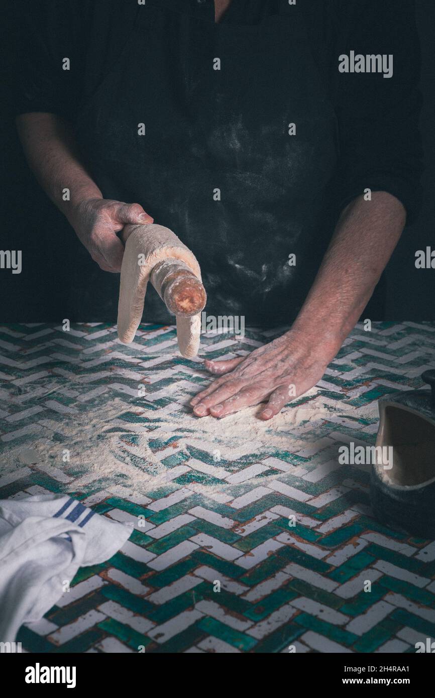 Old woman making pasta Stock Photo - Alamy