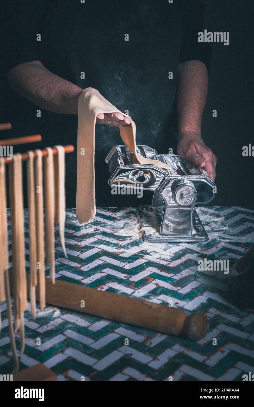 Old woman making pasta Stock Photo - Alamy