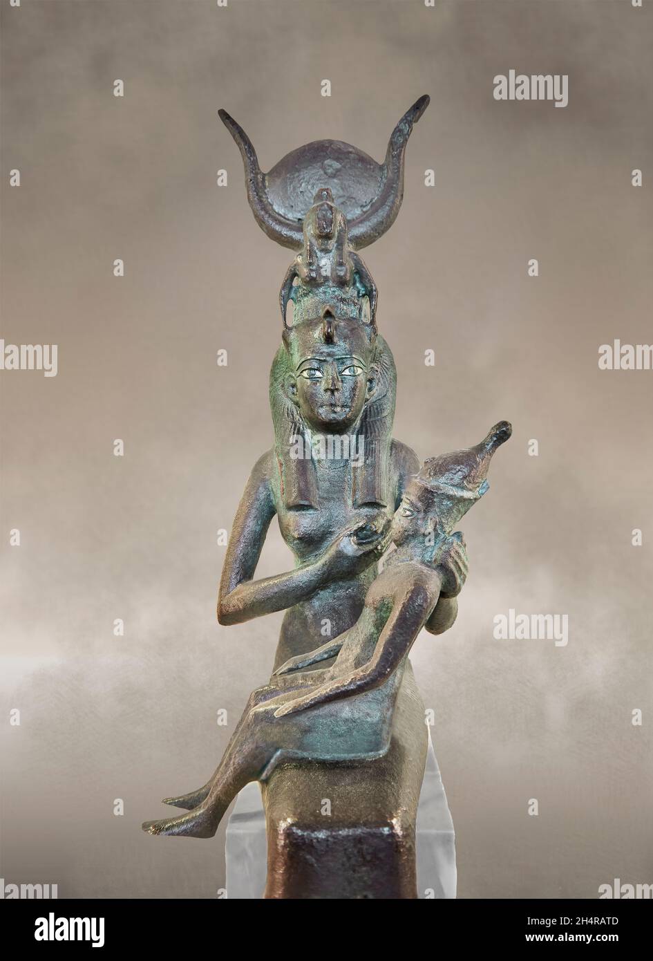 Ancient Egyptian copper figurine of Isis nursing Horus, 664-332 BC, Saqqara, Serapeum Memphis. Louvre Museum N 5022. Sully Room 643. Isis is breastfee Stock Photo