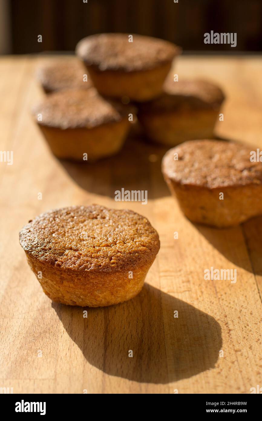 Financial Cake Financier cake on a wood board Stock Photo - Alamy