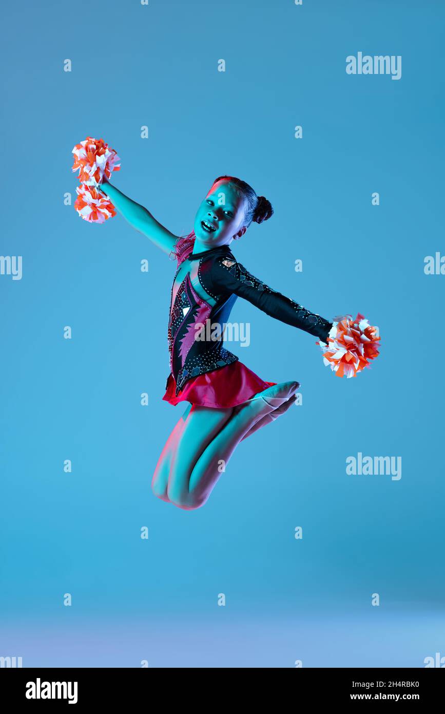 full-length-portrait-of-beautiful-girl-cheerleader-training