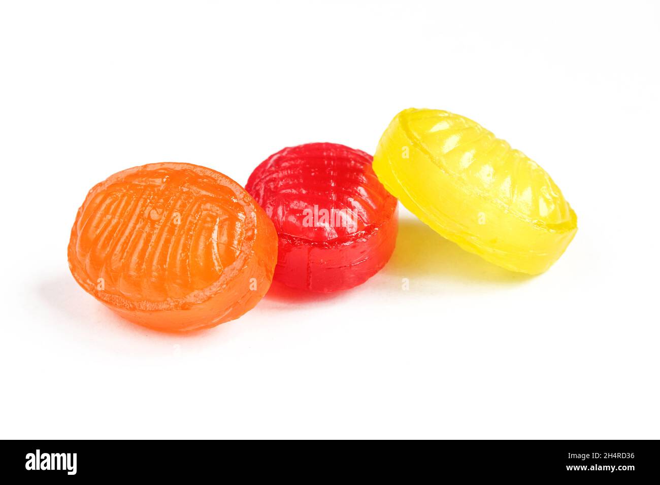 Colorful hard candies isolated on white background. Pile of bonbons