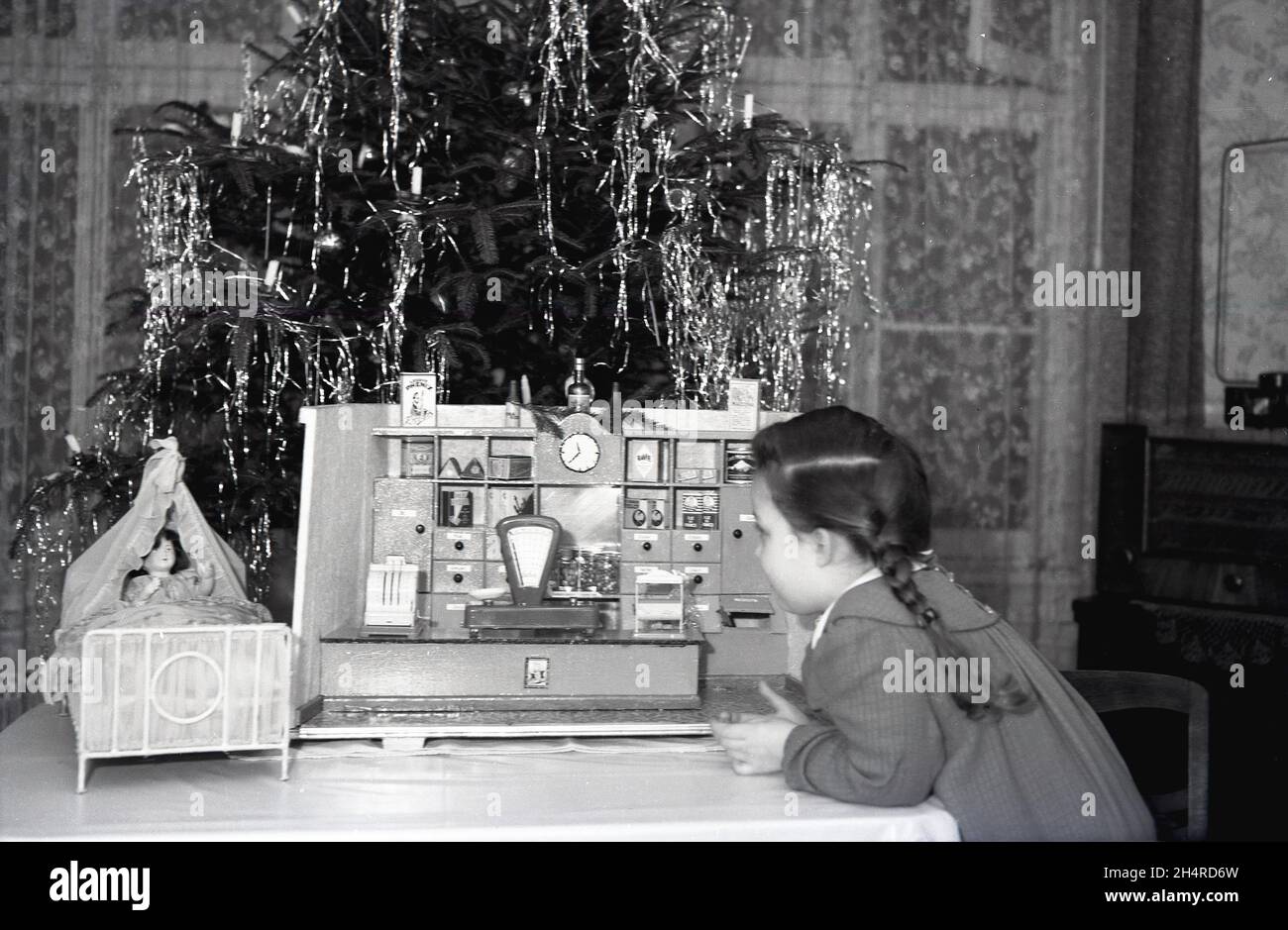 1960s historical christmas time and inside a living room beside