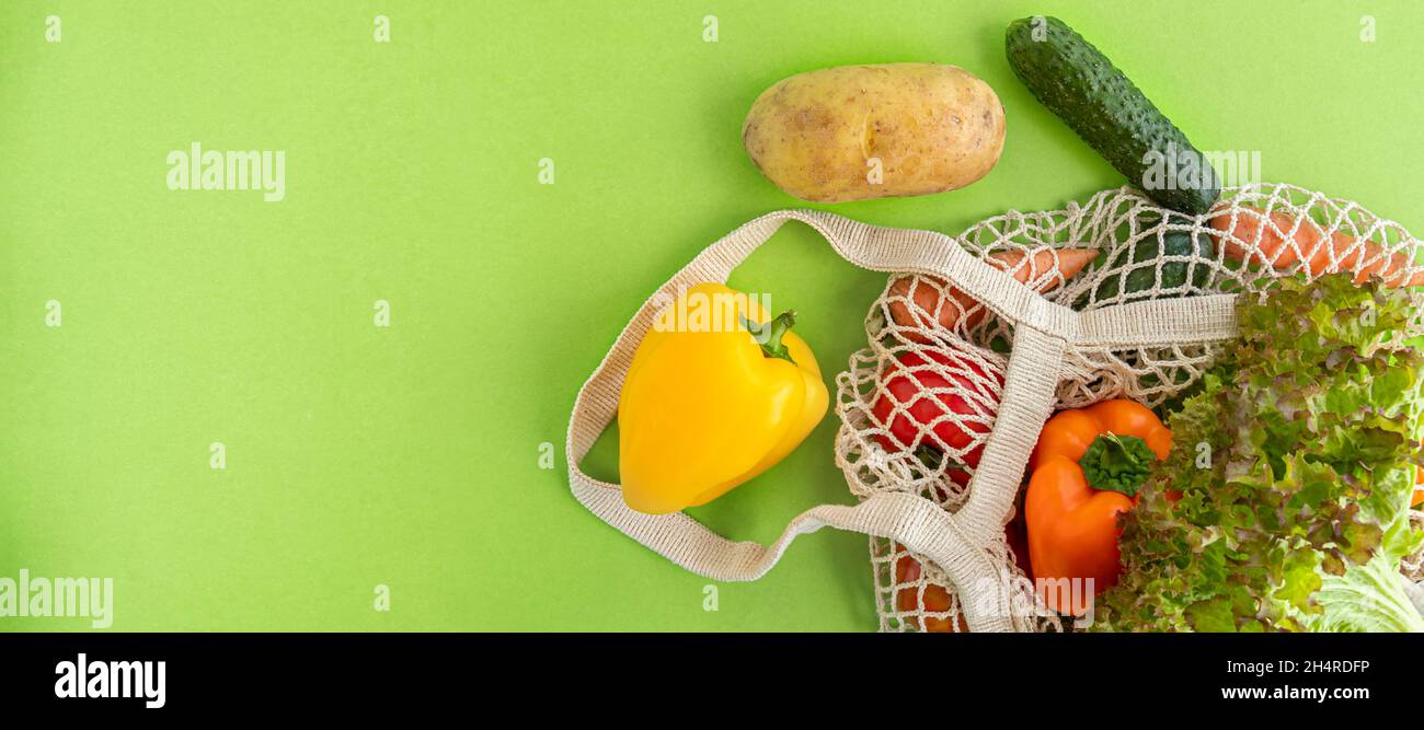 banner with Package-free food shopping. top view of eco friendly natural bag with vegetables. Zero waste concept. Sustainable lifestyle concept. Plastic free items. Flat lay. Copy space Stock Photo