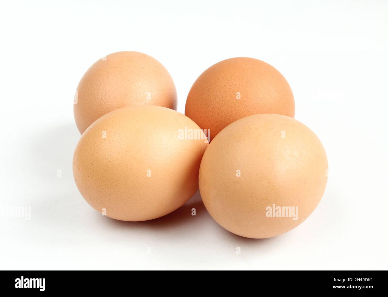 Group of uncooked eggs isolated on white background. Stock Photo