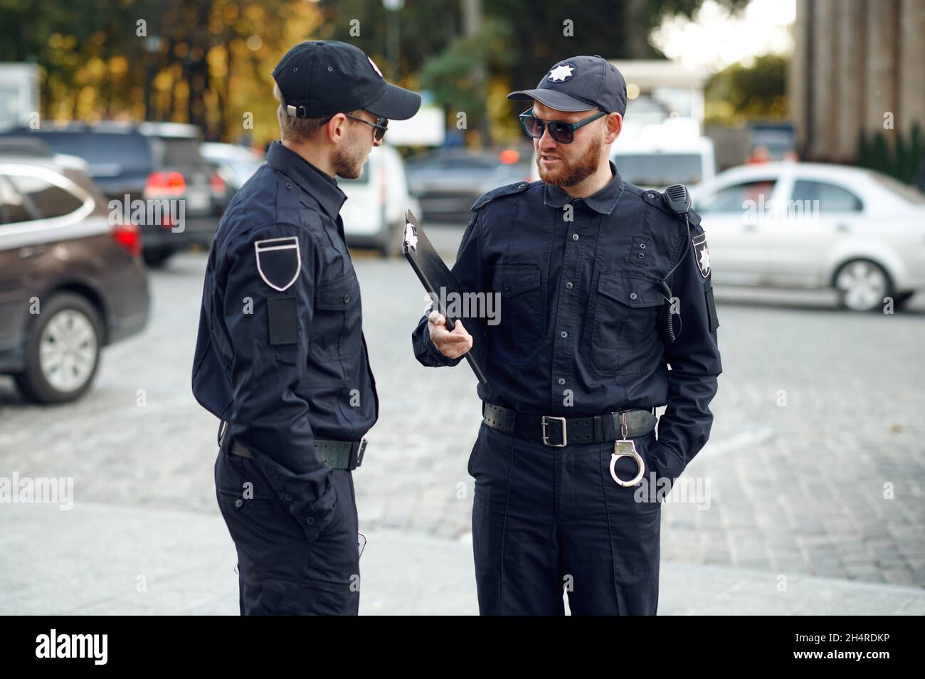 Two male police officers in sunglasses Stock Photo Alamy