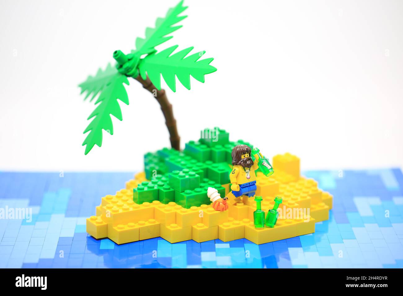 the sailor need help on the island after shipwreck. Lego Stock Photo