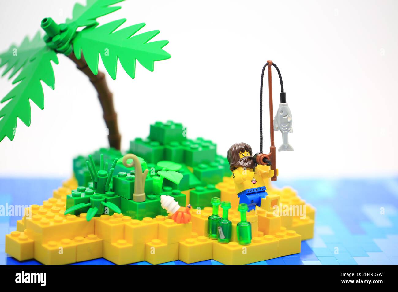 the sailor need help on the island after shipwreck. Lego Stock Photo