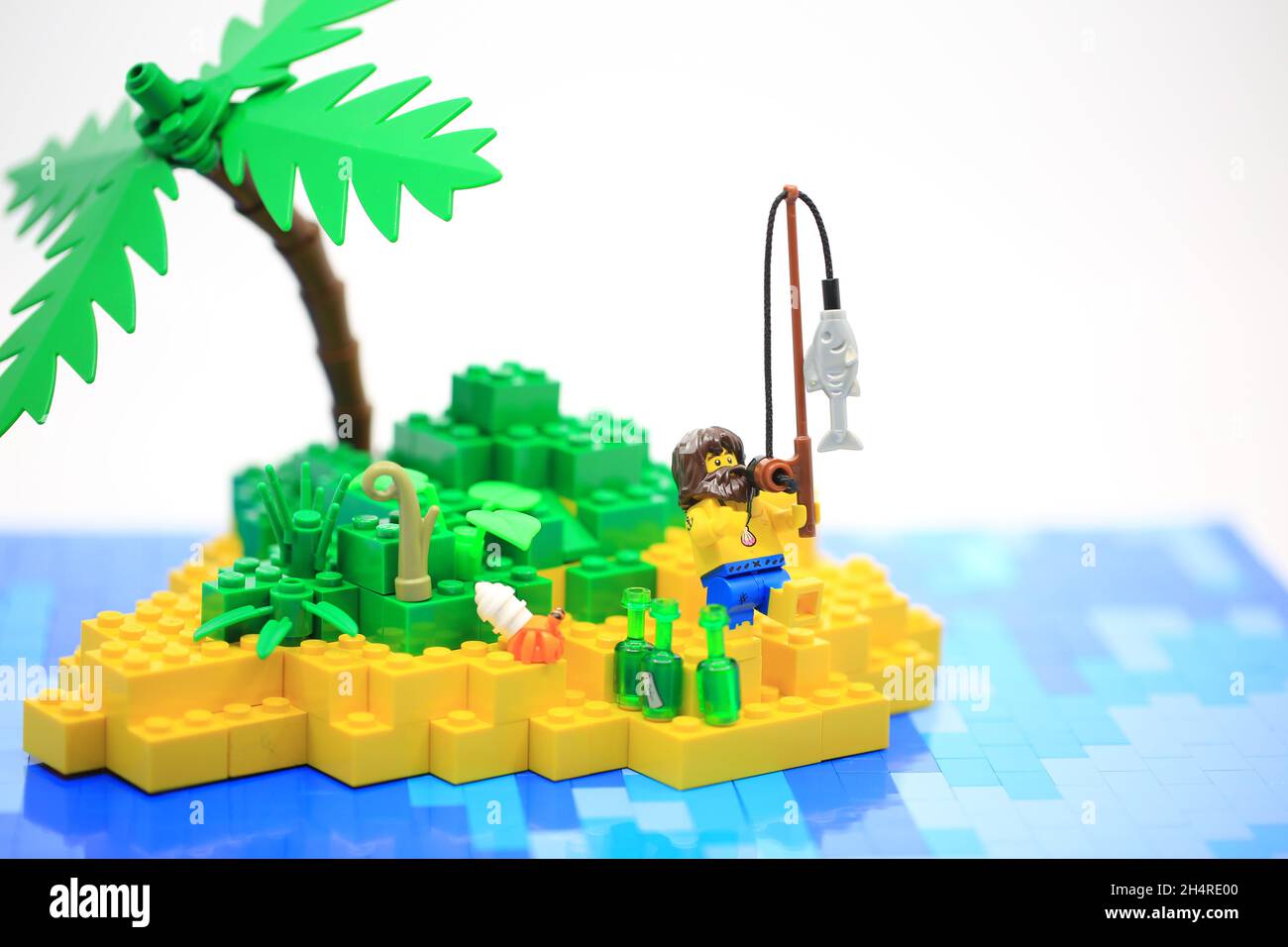 the sailor need help on the island after shipwreck. Lego Stock Photo