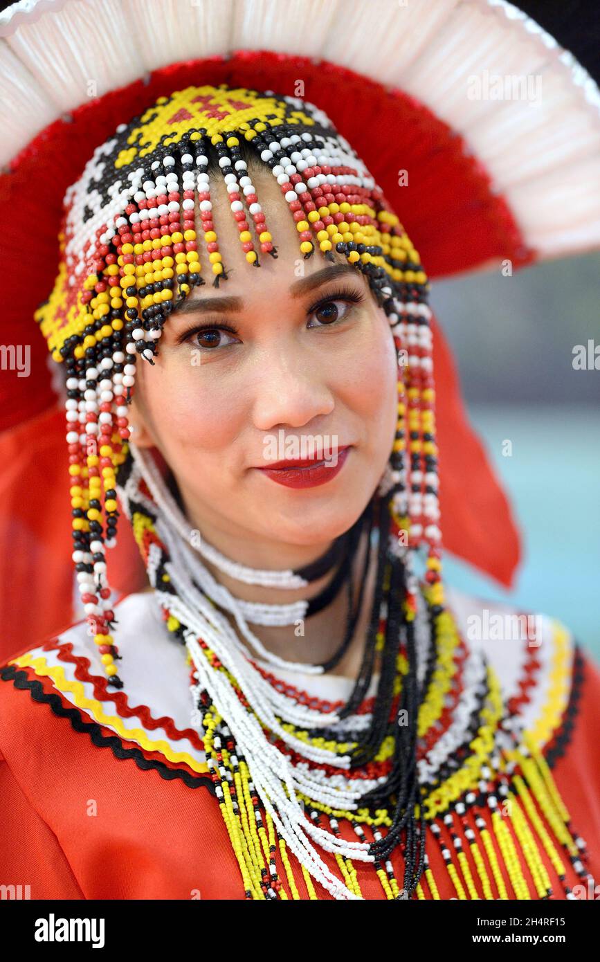 Woman wearing traditional Philippine costume at the Philippines stand at the World Travel Market (WTM) at ExCel London, November 2021 Stock Photo