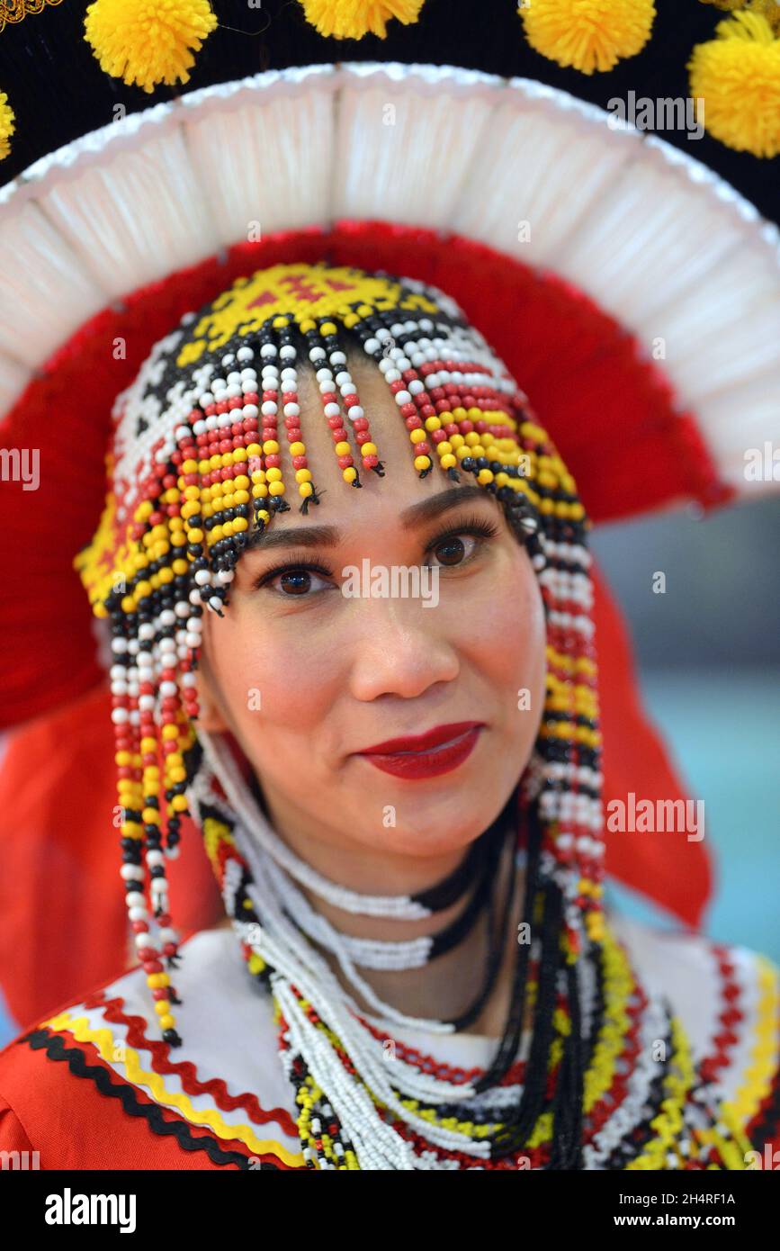 Woman wearing traditional Philippine costume at the Philippines stand at the World Travel Market (WTM) at ExCel London, November 2021 Stock Photo