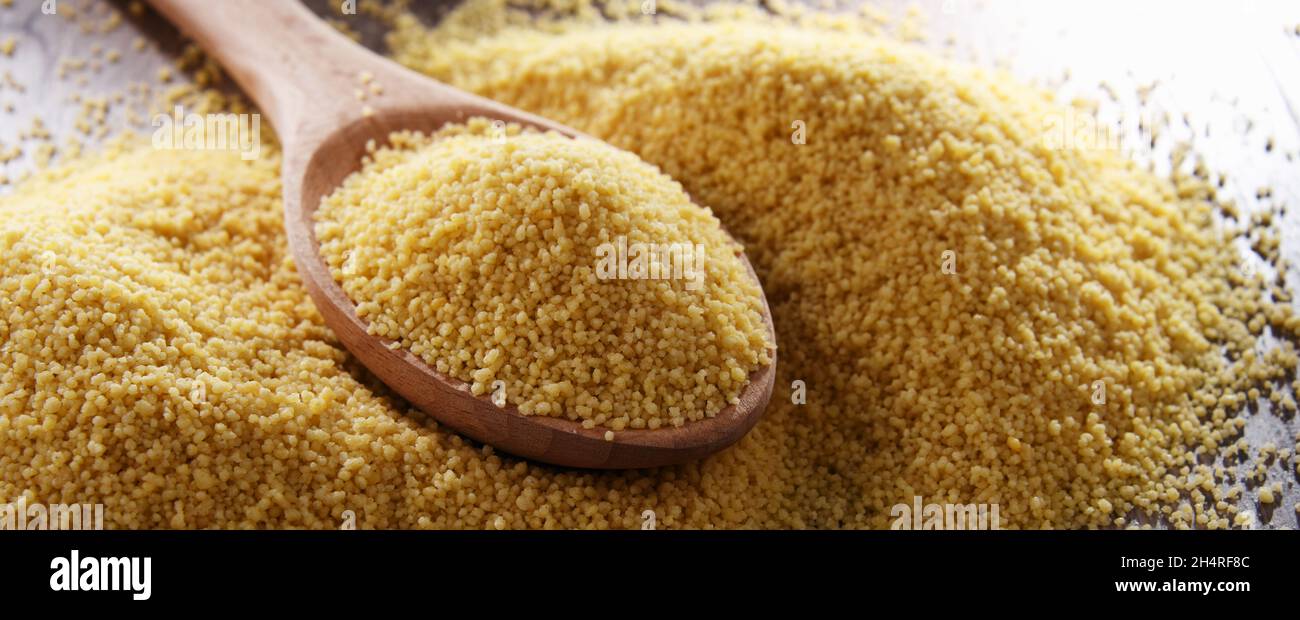 Composition with uncooked couscous. Stock Photo