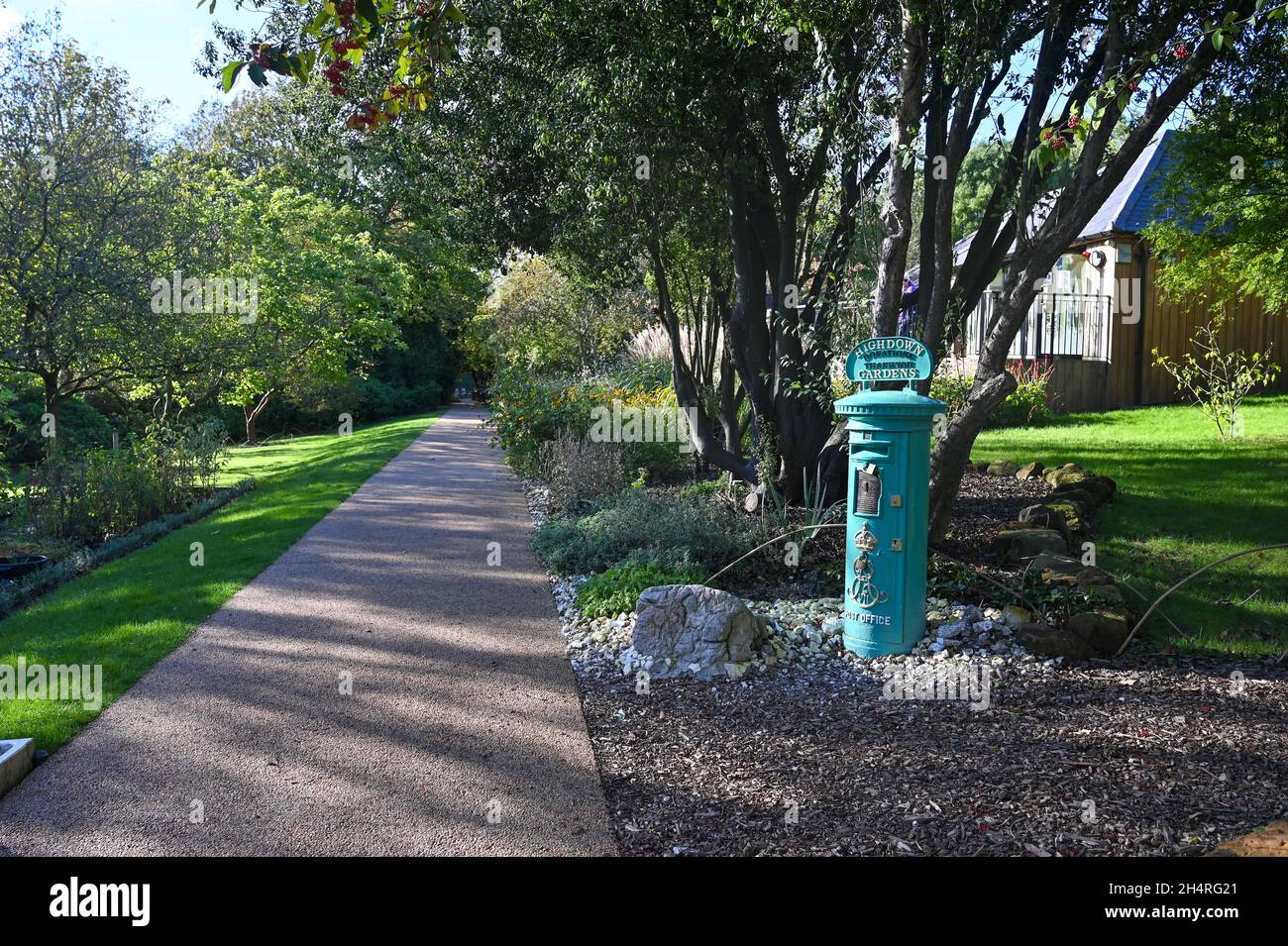 Old green post box used for donations at Highdown Chalk Gardens Worthing West Sussex Stock Photo