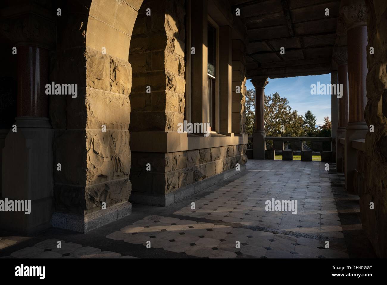 Empty outdoor hall of the famous historic Craigdarroch Castle in Victoria during the daytime Stock Photo
