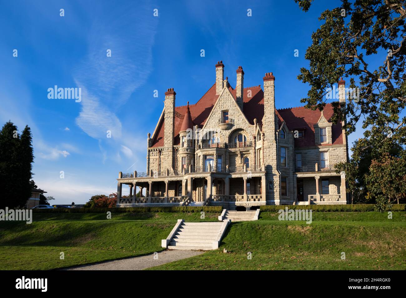 Famous historic Craigdarroch Castle in Victoria against a blue sky on a sunny day Stock Photo