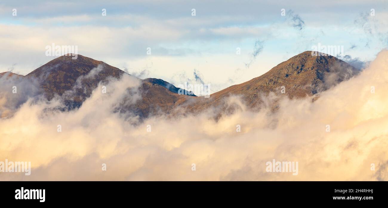 Torreneules summits (peaks) above the clouds. Queralbs, Vall de Núria, El Ripollès, Girona, Catalonia, Spain. Stock Photo