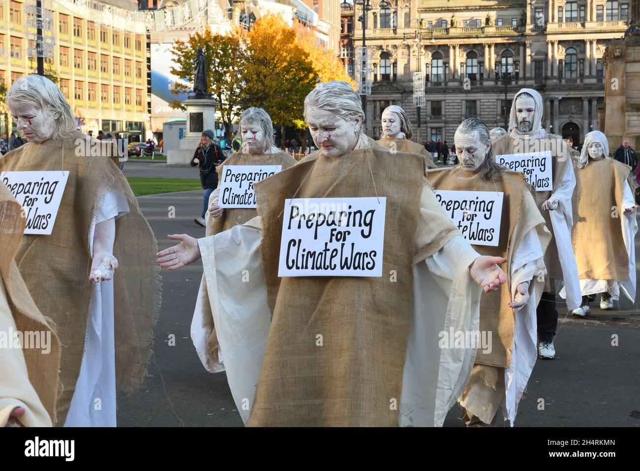 Glasgow, UK. 4th Nov, 2021. UK. Climate change interest group making statement by dressing in doomsday costumes and carrying placards saying 'Preparing for climate wars'. Credit. Credit: Douglas Carr/Alamy Live News Stock Photo