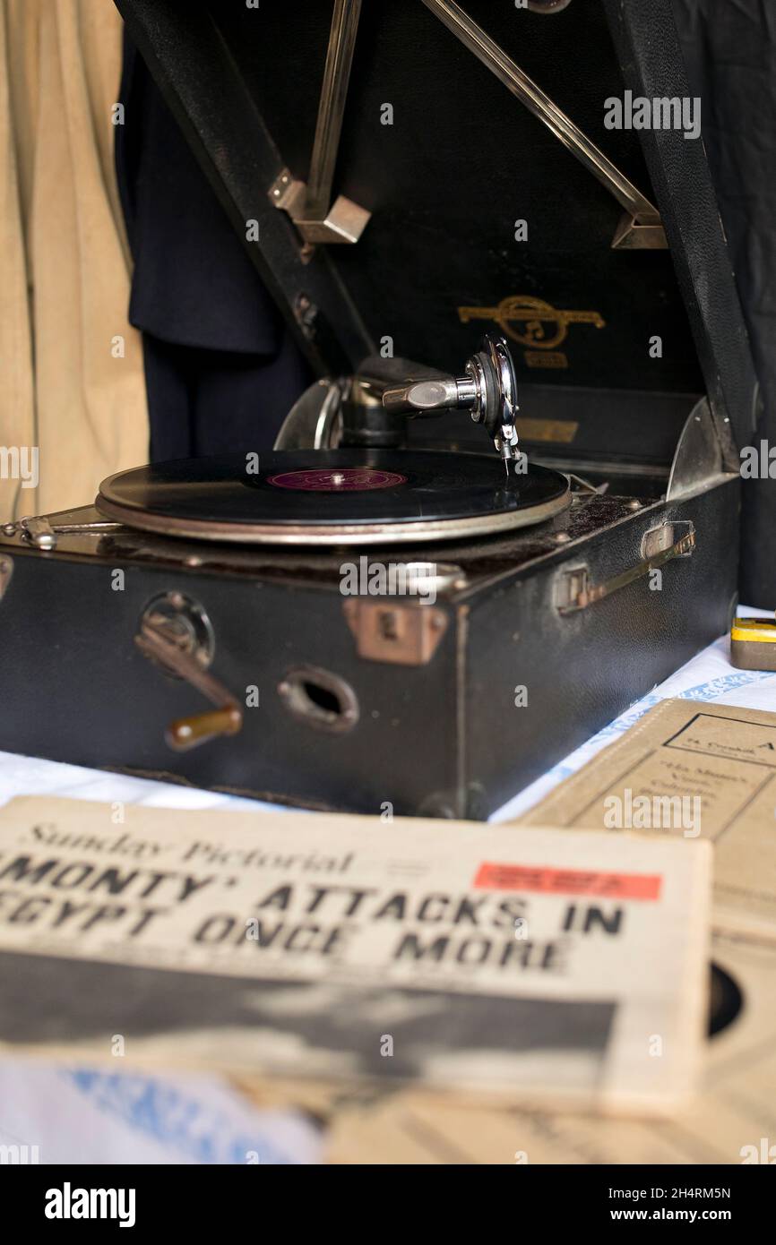 Record playing on wind-up gramophone player in wartime Britain Stock Photo