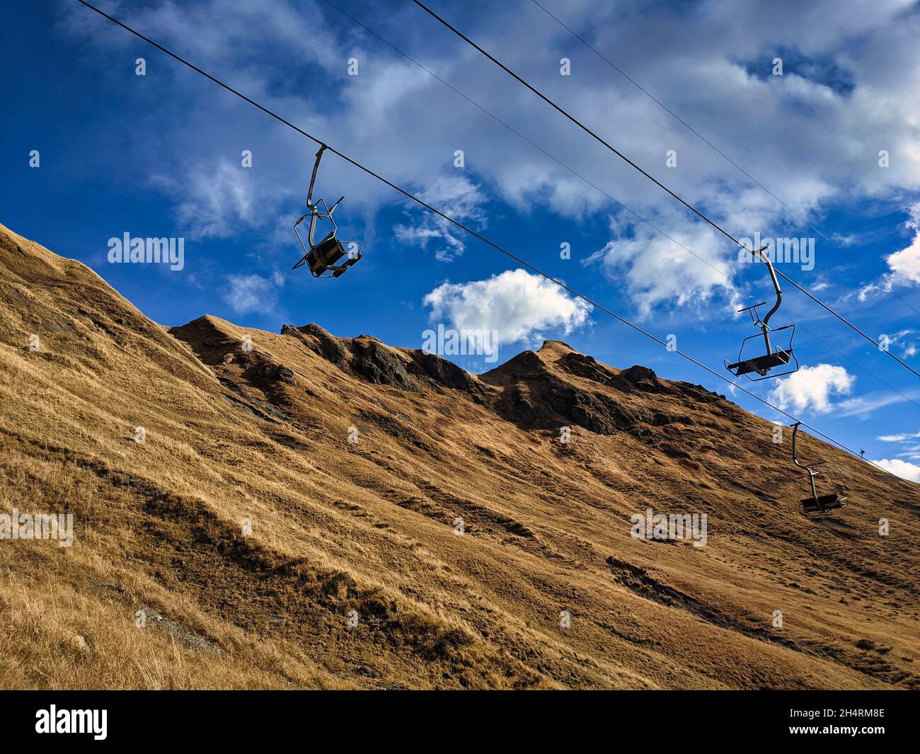 chairlift in the off season. two chairlifts in elm, glarus, switzerland Stock Photo