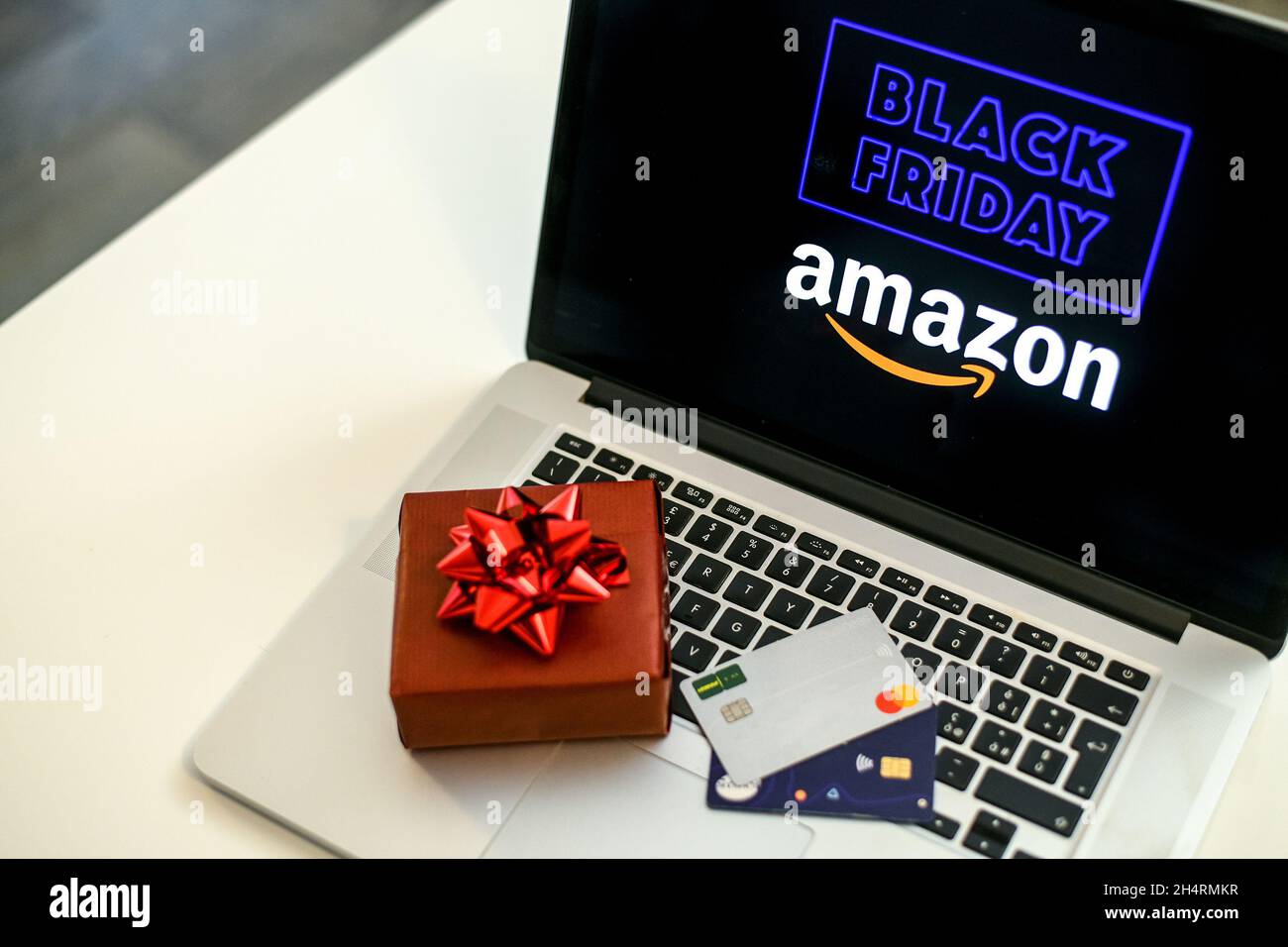 Purchasing Christmas gift in the Amazon online shop the black friday. Logo  on the laptop monitor. Purchase of Christmas gifts. E-commerce, tech, shopp  Stock Photo - Alamy