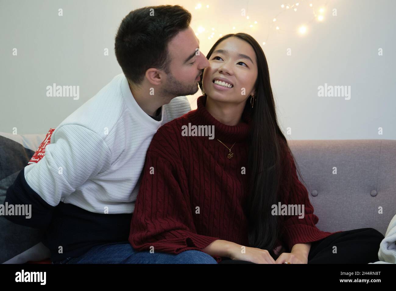 Man with Christmas surprise present for his girlfriend. Stock Photo
