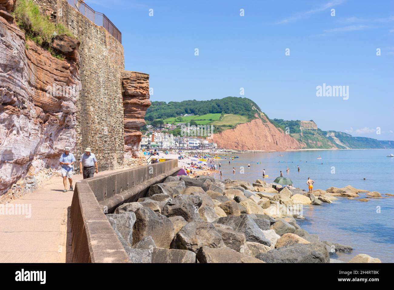 Sidmouth Devon People walking on the Esplanade around the cliff part of the S W coast path Sidmouth Town Sidmouth Devon England UK GB Europe Stock Photo