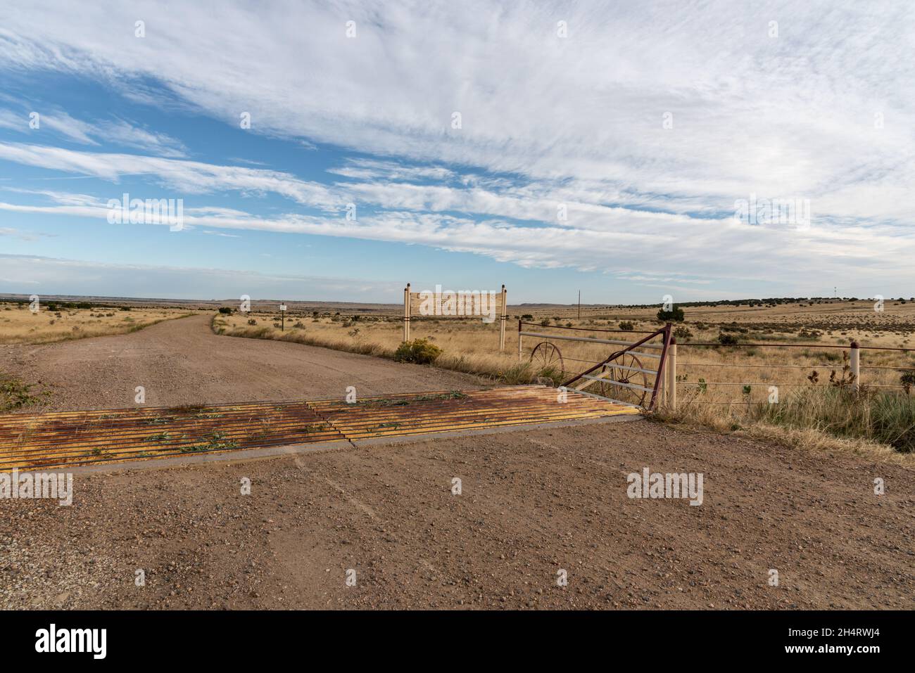 Longshot of the Red Top Ranch in the semiarid Great Plains in Pueblo County, Colorado, a cattle guard at the entrance. Stock Photo