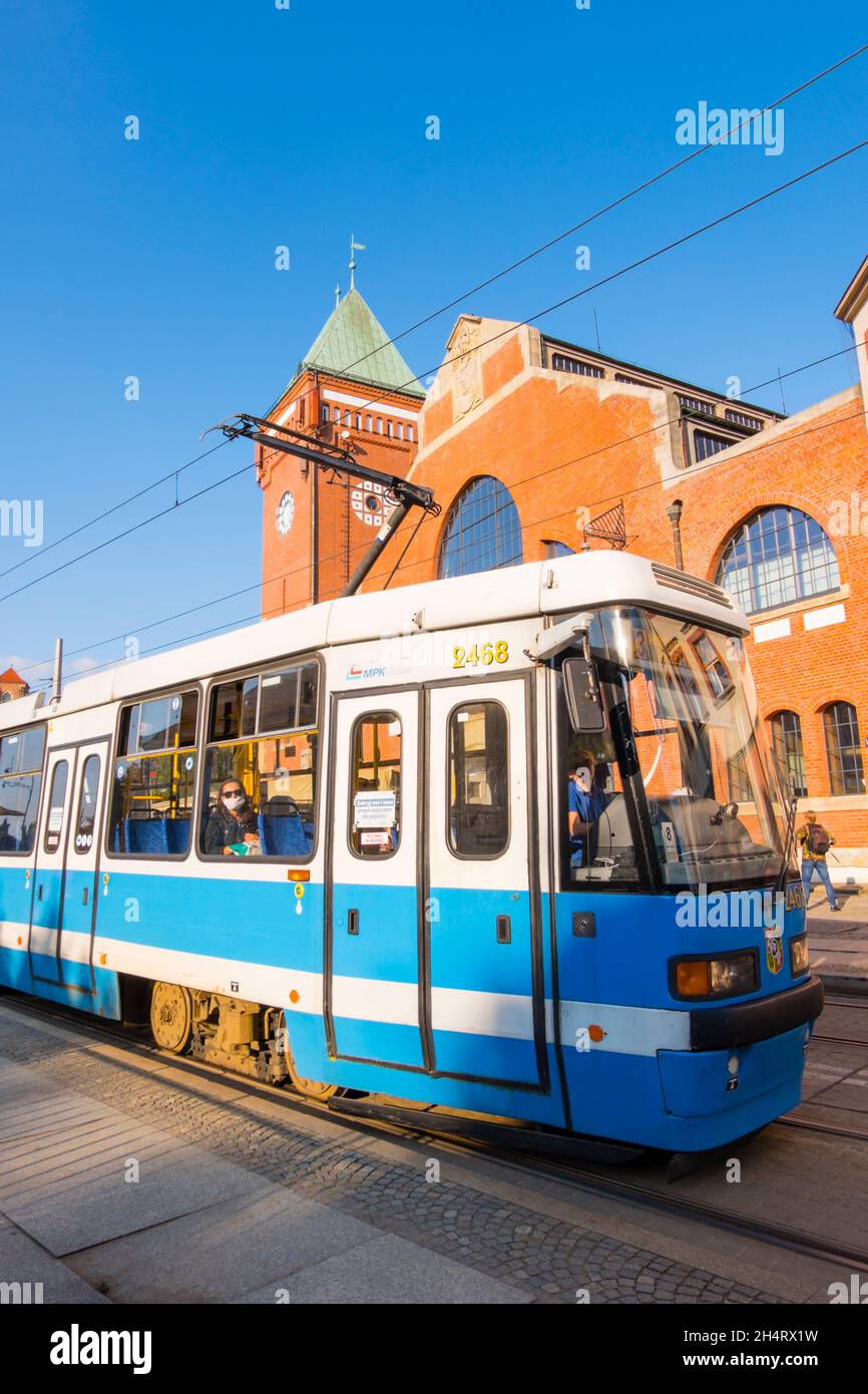 Tram going past Hala Targowa, market hall, Piaskowa, Wroclaw, Poland Stock Photo