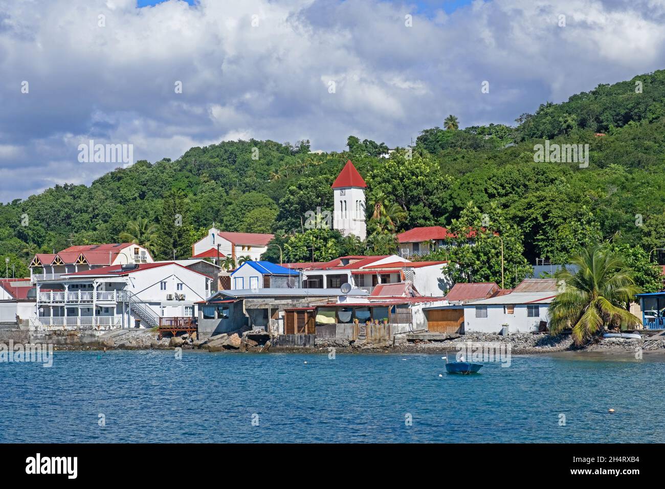 View over the village Deshaies on the northwest coast of Basse-Terre Island, archipelago of Guadeloupe, Lesser Antilles in the Caribbean Sea Stock Photo