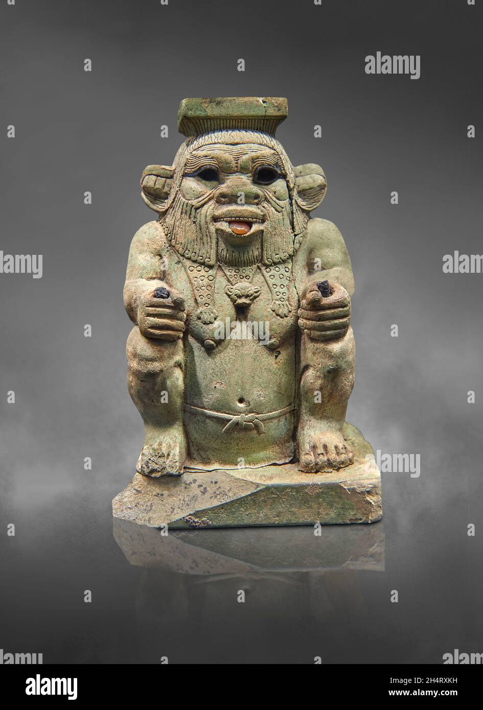 Egyptian statue sculpture of the god Bes, 664-525 BC, 16th dynasty,  . Louvre Museum E10929.  Bes is squatting wearing the panther skin, beard, protru Stock Photo