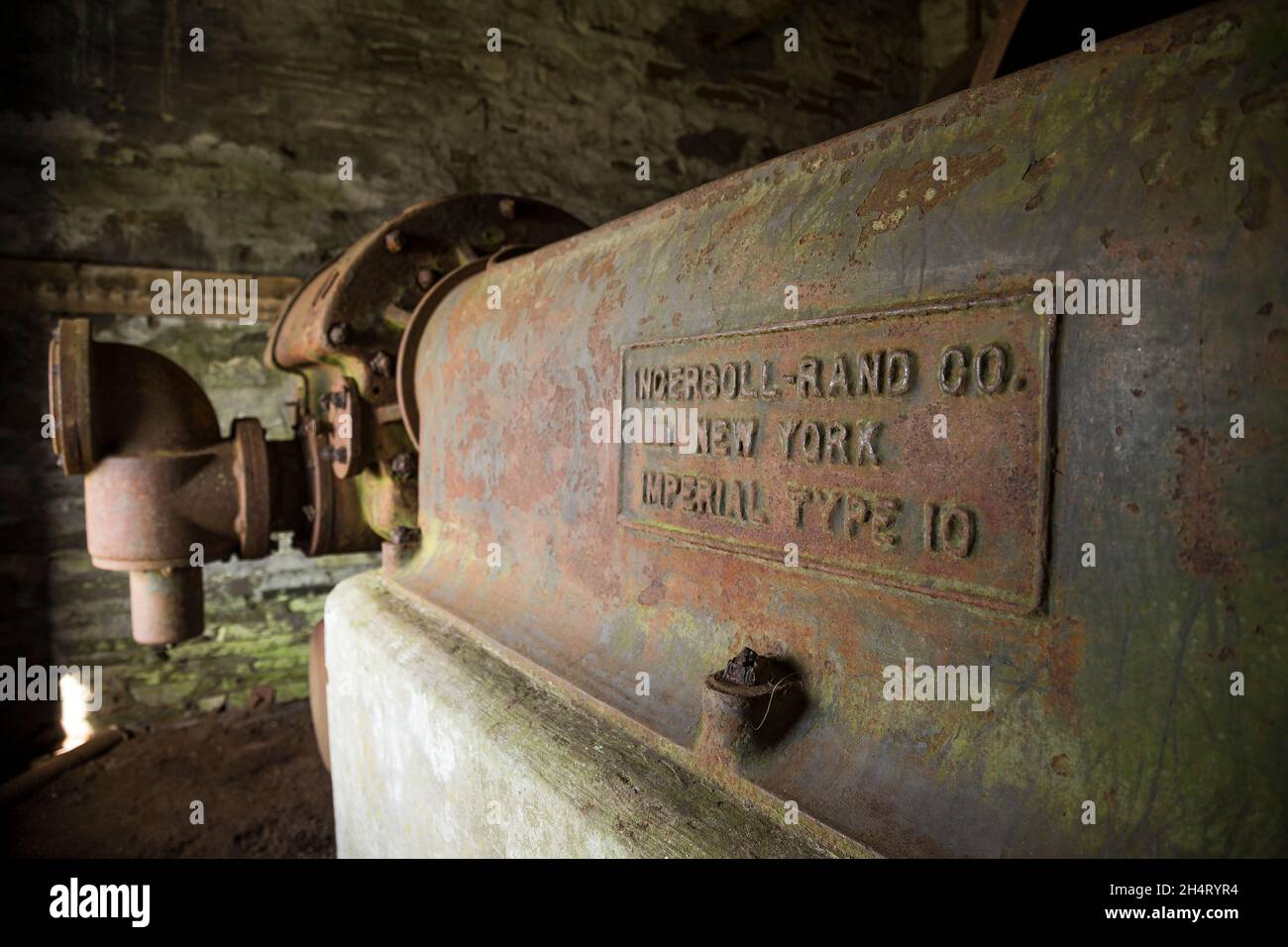 Old machinery in derelict, disused slate quarry building, North Wales, UK. Stock Photo