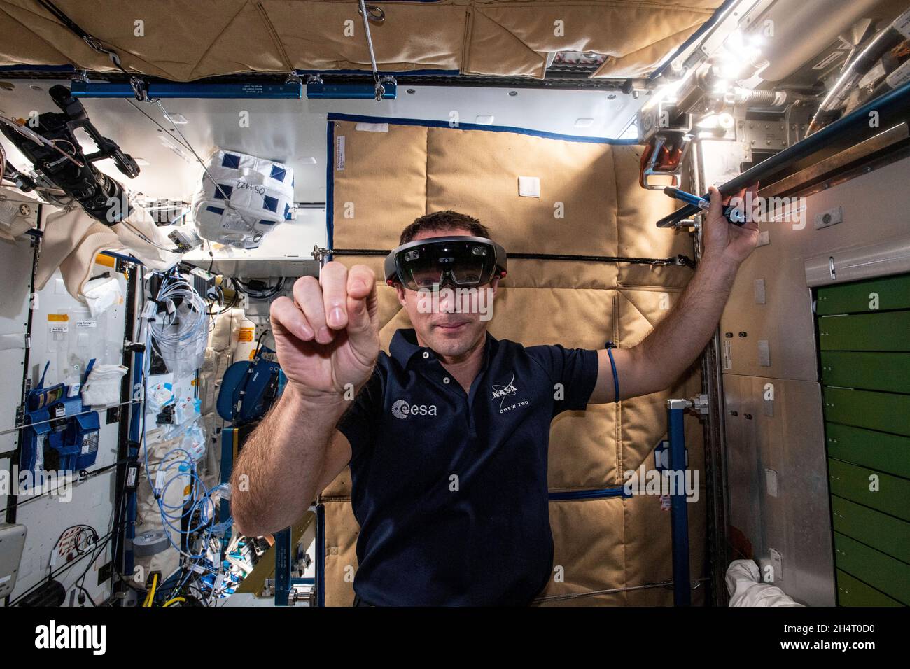 Expedition 65 Flight Engineer Thomas Pesquet of ESA (European Space Agency) wears the Sidekick augmented reality goggles that assist crew members during operations with science experiments and orbital maintenance tasks on July 6, 2021. Credit: NASA via CNP Stock Photo