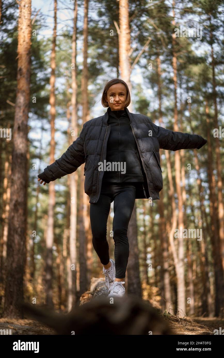 Girl walking alone in forest hi-res stock photography and images - Alamy