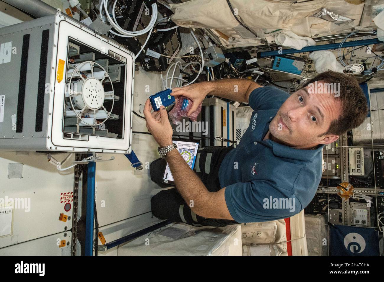 Expedition 65 Flight Engineer Thomas Pesquet of ESA (European Space Agency) installs the Molecular Muscle Experiment-2 (MME-2) inside the Columbus laboratory module. MME-2 tests a series of drugs to see if they can improve health in space possibly leading to new therapeutic targets for examination on Earth on June 5, 2021. Credit: NASA via CNP Stock Photo