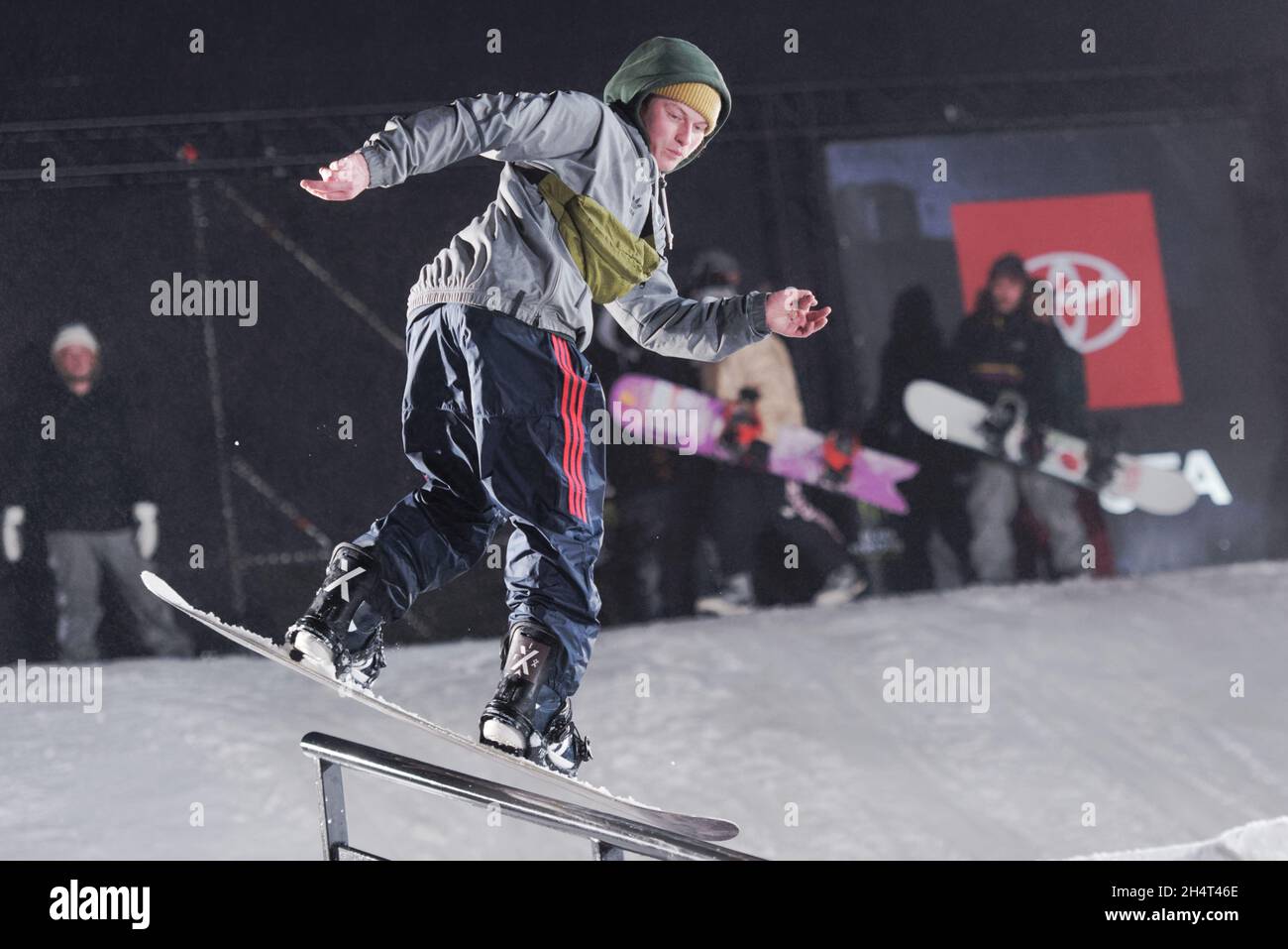 St. Petersburg, Russia, 23rd February, 2019: Snowboarder performs trick during the festival of extreme snowboarding Stairs and Rails Stock Photo
