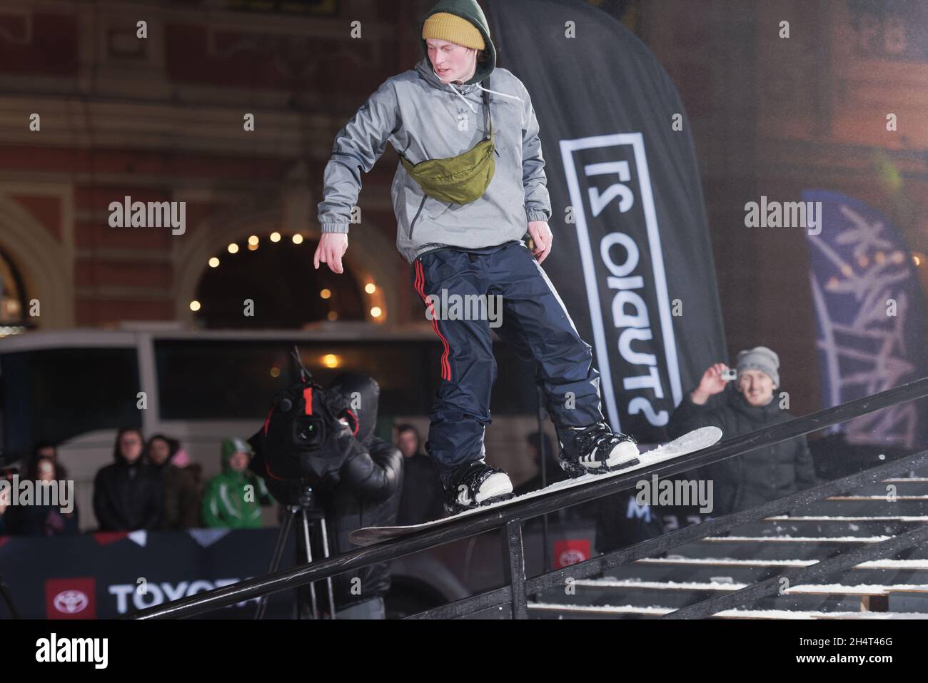 St. Petersburg, Russia, 23rd February, 2019: Snowboarder performs trick during the festival of extreme snowboarding Stairs and Rails Stock Photo